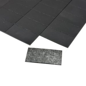a black tile on a white surface