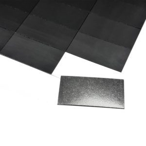 a black rectangular object on a white surface